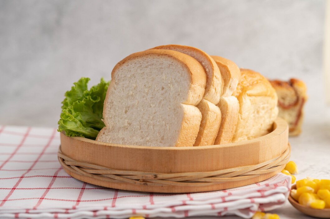 bread-wooden-tray-red-white-cloth_1150-23896