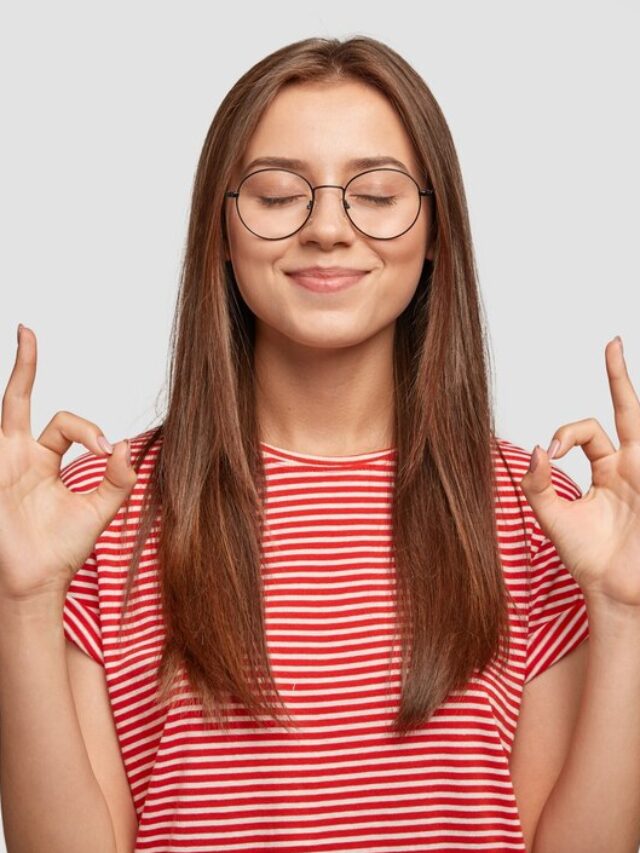 pleased-satisfied-young-female-model-makes-zero-gesture-wears-transparent-glasses-has-long-dark-hair_273609-17999