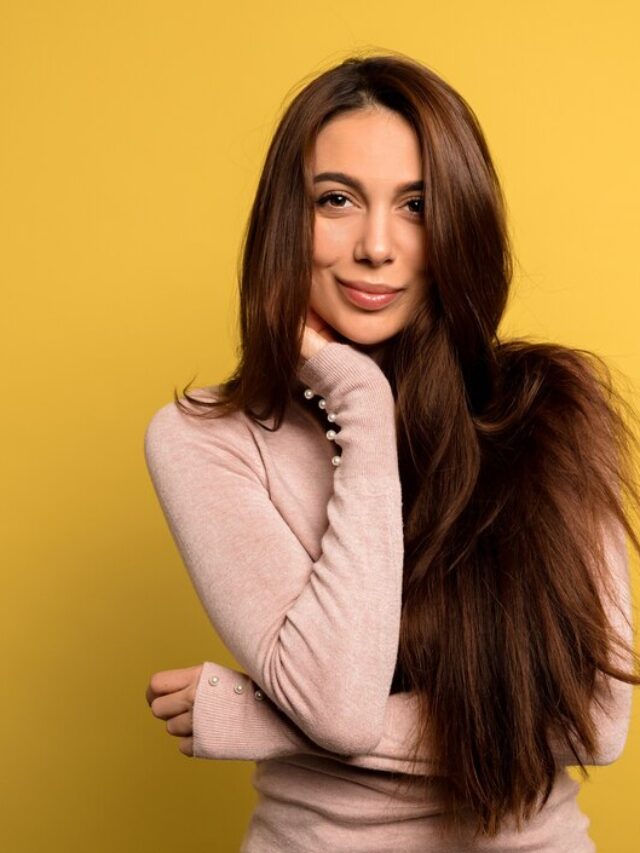 tender-beautiful-girl-with-dark-hair-wearing-pink-shirt-posing-studio-shot-blissful-brunette-woman_291650-187
