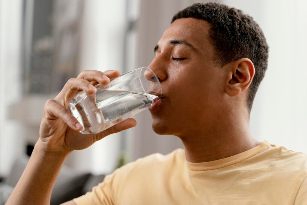 portrait man home drinking glass water 23 2148923946 portrait-man-home-drinking-glass-water_23-2148923946
