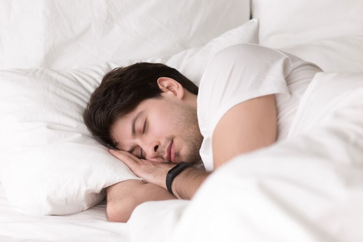 young guy sleeping bed wearing smartwatch sleep tracker 1163 5232 young-guy-sleeping-bed-wearing-smartwatch-sleep-tracker_1163-5232
