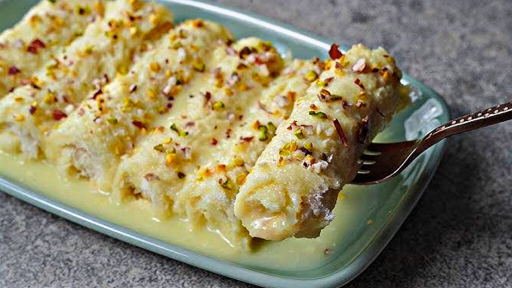 Make the kids happy—treat them to Bread Malai Rolls; here is how to make them with great ease