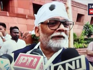 Pappu Yadav arrived at Parliament with a plaster cast and a cane.
