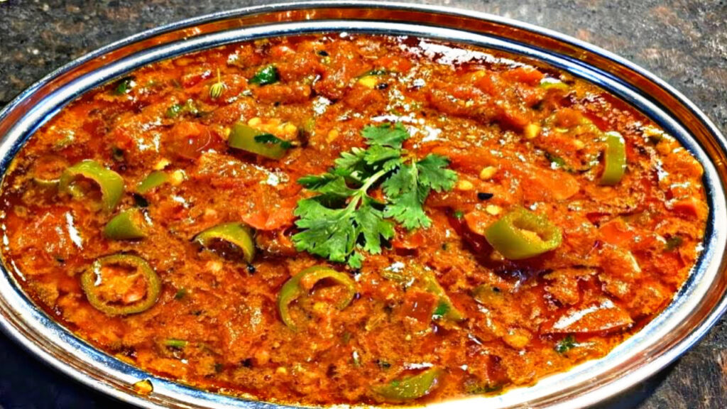 If you’re tired of boring food, try something new! Make Rajasthani Tamatar Mirch ke Tipore at home, learn the recipe