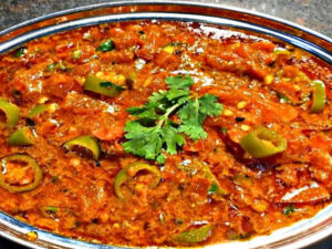 If you’re tired of boring food, try something new! Make Rajasthani Tamatar Mirch ke Tipore at home, learn the recipe